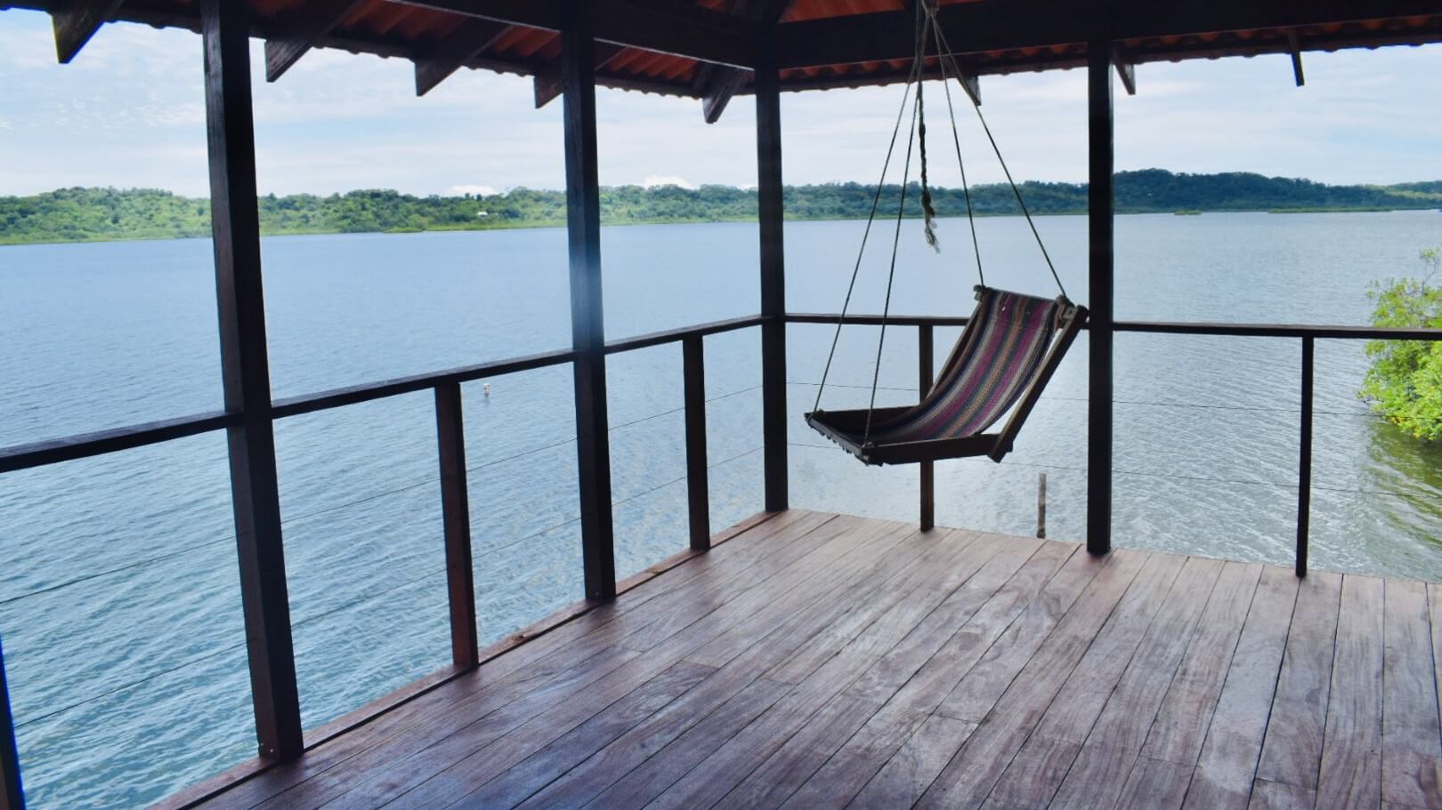 A swing chair on the porch of a house